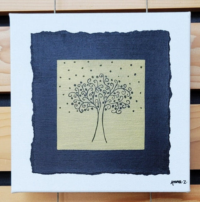 Intricate metallic block print of a fruit laden tree with swirling branches reaching for the stars, embossed on a black background. Deep gold colored embossing on black cardstock and white canvas.