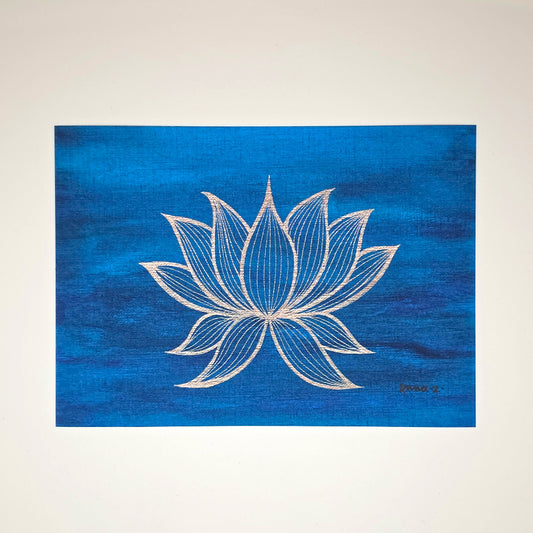 Botanical themed art print of a golden yellow lotus blossom against a deep blue background with hints of green.