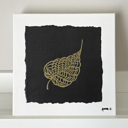 Intricate metallic block print of leaf veins embossed on a black background. Deep gold colored embossing on black cardstock and white canvas.
