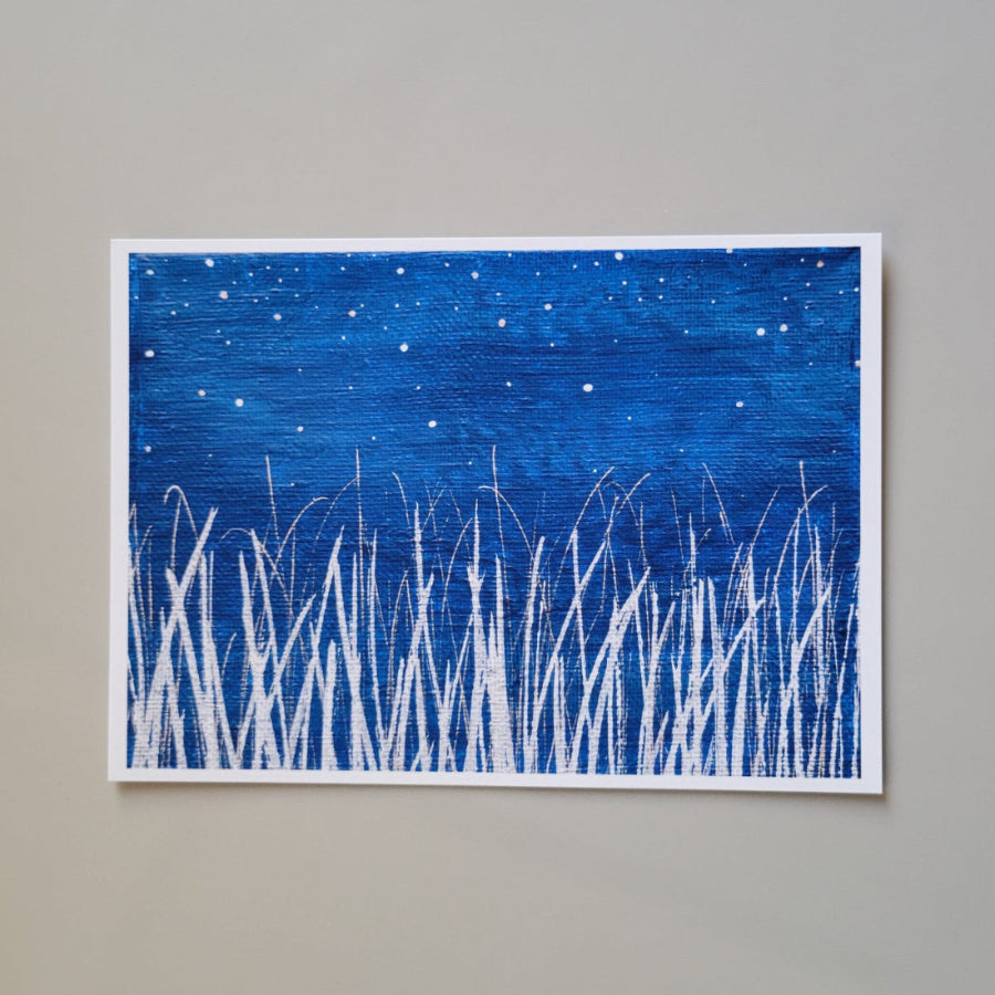 Landscape and botanical themed art print featuring a silvery white grassy horizon against a deep blue starry night. Image adapted from original acrylic painting on canvas. High quality print reproduction on specialty fine art printing paper.