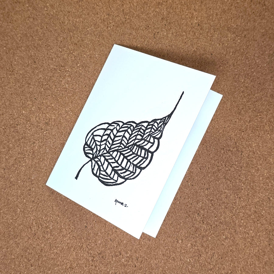 Notecard featuring a digital print reproduction of an original hand-carved block print artwork of a beautiful single leaf with details of veins. Black and white artwork.