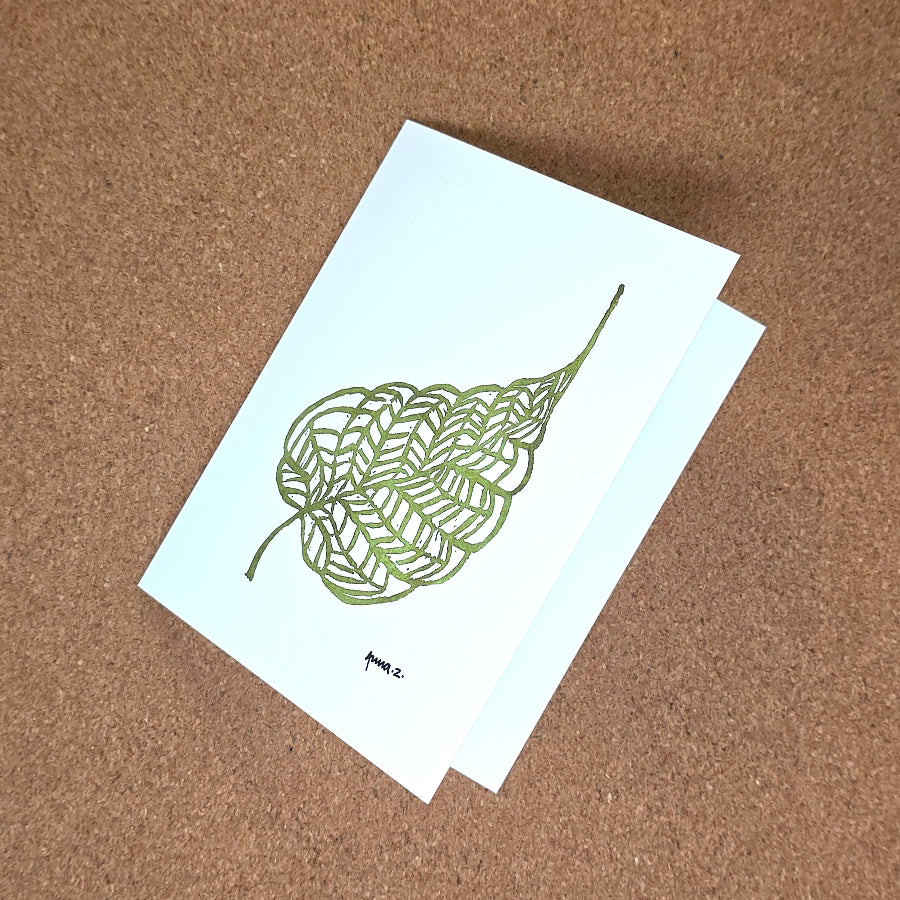 Notecard featuring a digital print reproduction of an original hand-carved block print artwork of a beautiful single leaf with details of veins. Green and white artwork.