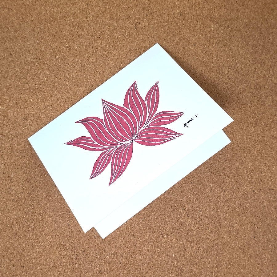 Notecard featuring a digital print reproduction of an original hand-carved block print artwork of a lotus. Red and white artwork.