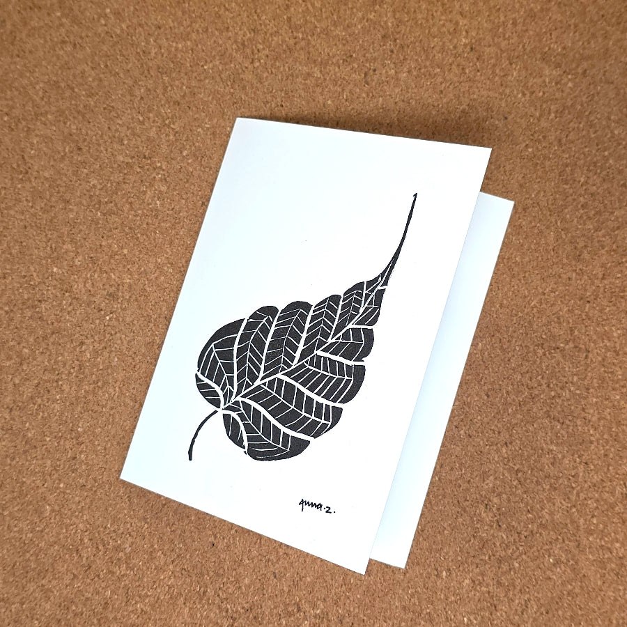 Notecard featuring a digital print reproduction of an original hand-carved block print artwork of a beautiful single leaf. Black and white artwork.