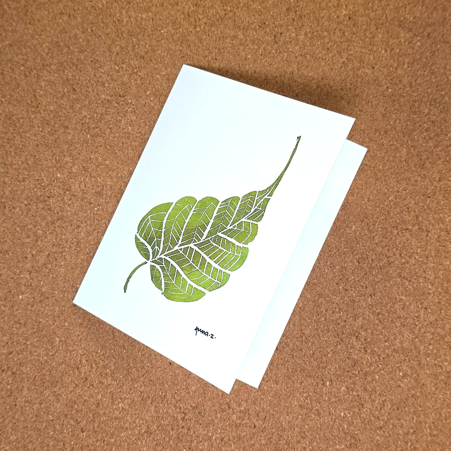 Notecard featuring a digital print reproduction of an original hand-carved block print artwork of a beautiful single leaf. Green and white artwork.