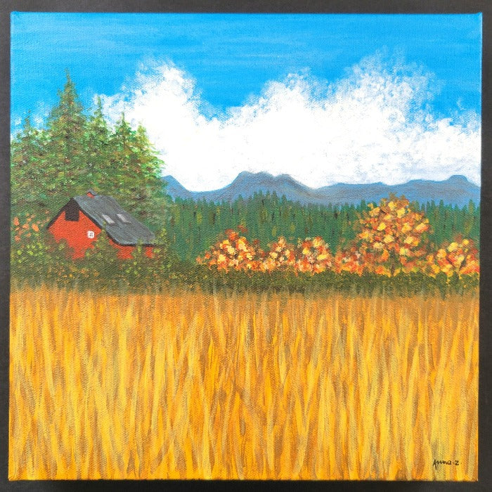 Original painting by Annazach Art. A red barn sits just beyond a golden field, next to tall evergreens and fruit trees with autumn leaves. The outline of the Cascade mountains frame the distant background. Inspired by a scene near the Evans Creek area in western Washington.