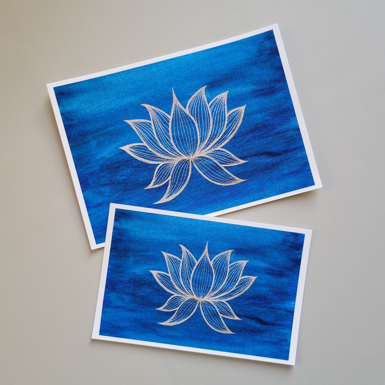Botanical themed art print of a golden yellow lotus blossom against a deep blue background with hints of green. Image adapted from original painting. Delicate details set against a bold background, in a strong yet serene atmosphere. High quality print reproduction on specialty fine art printing paper.