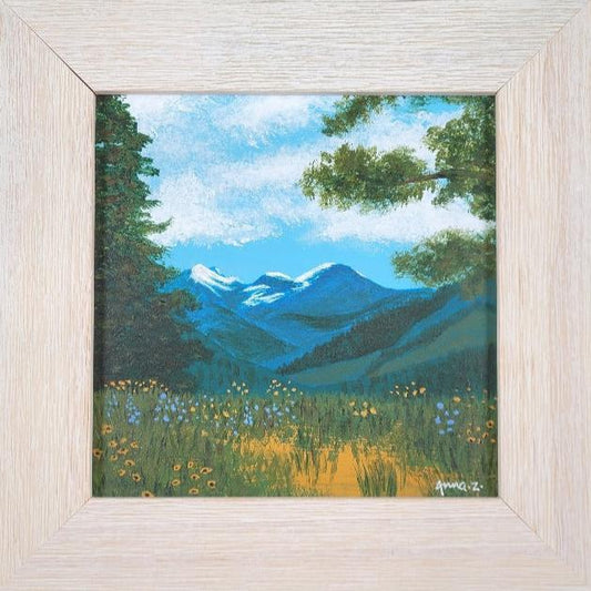 Original painting by Annazach Art. Miniature painting of distant mountains, framed by wildflowers and tall trees in the foreground, as seen from the top of Sun Mountain in Winthrop, Washington. 